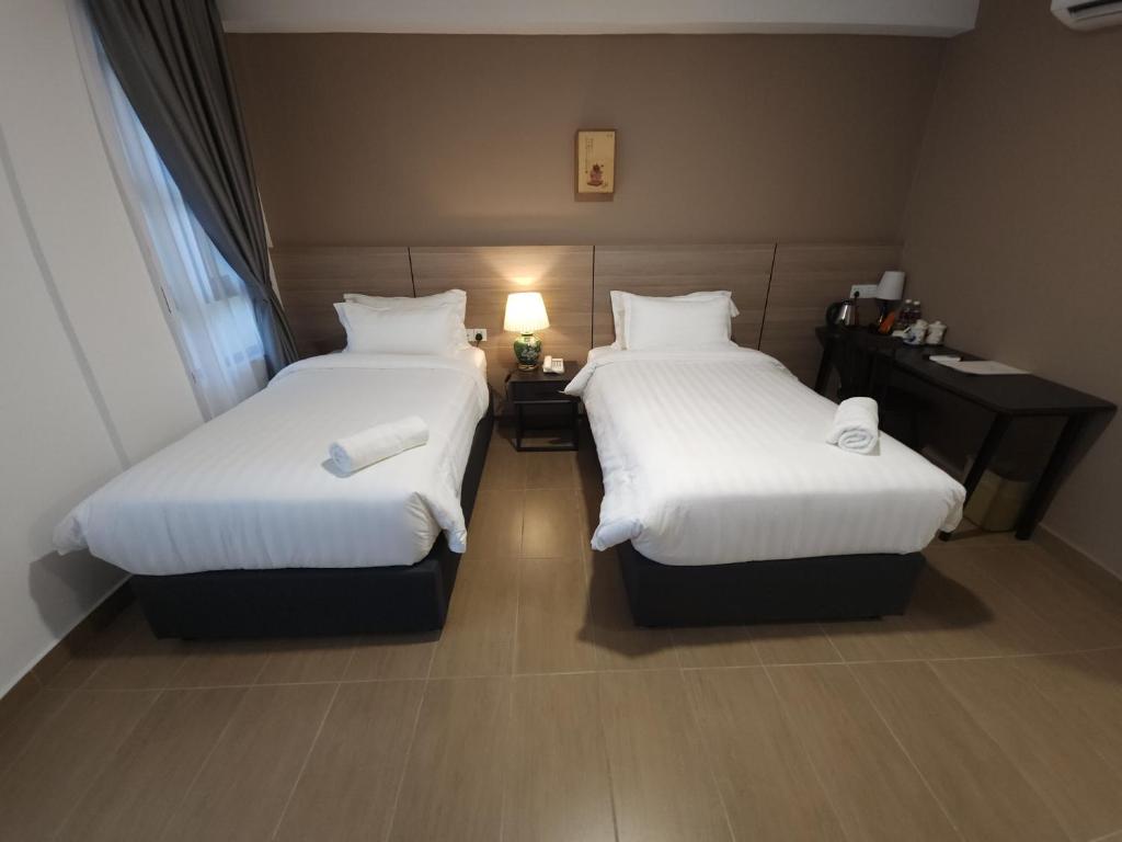 Postel nebo postele na pokoji v ubytování Yu Hotel Chinatown
