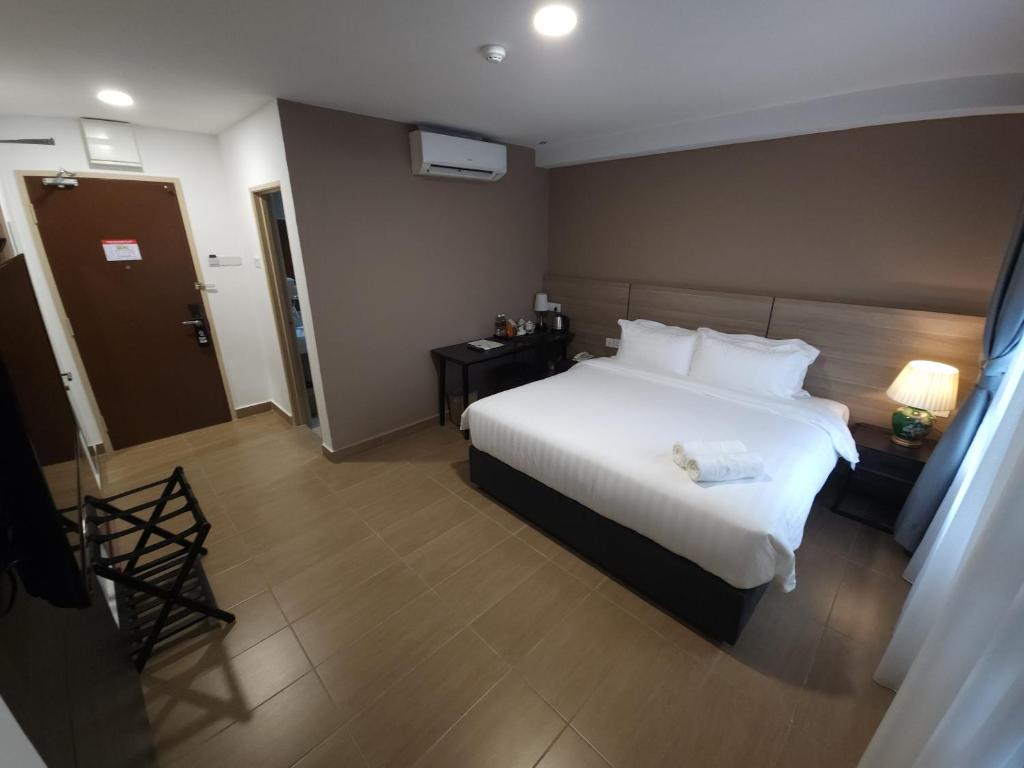 Postel nebo postele na pokoji v ubytování Yu Hotel Chinatown