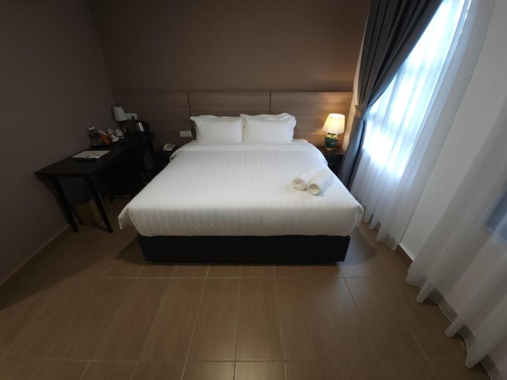 Postel nebo postele na pokoji v ubytování Yu Hotel Chinatown