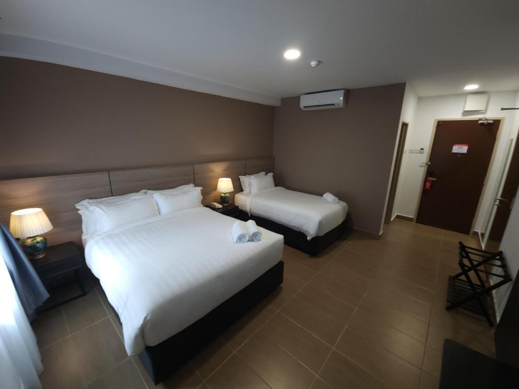 Postel nebo postele na pokoji v ubytování Yu Hotel Chinatown