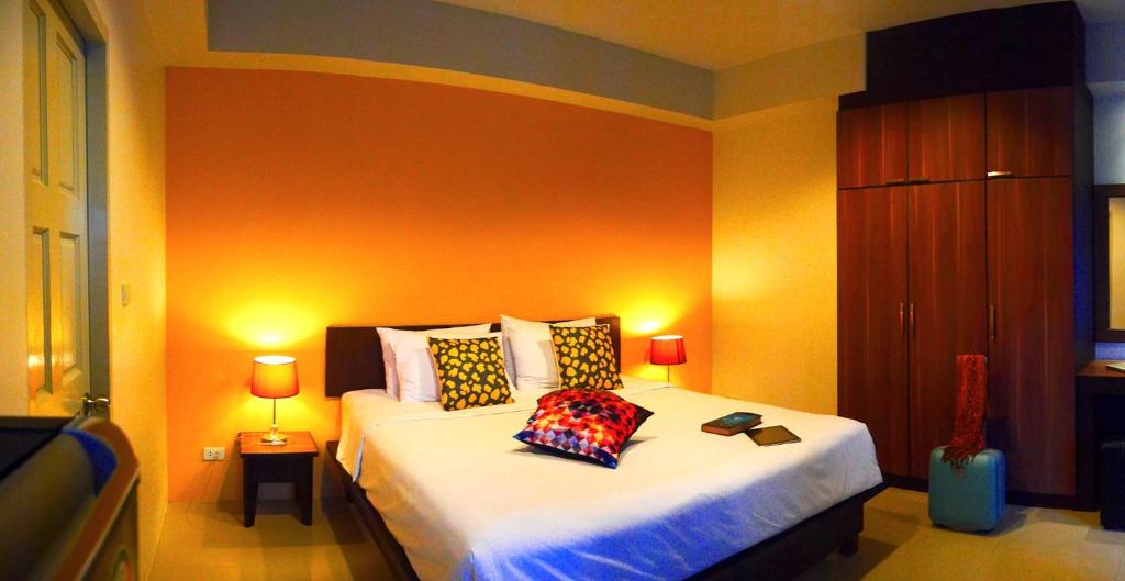 Postel nebo postele na pokoji v ubytování Cool Residence Hotel