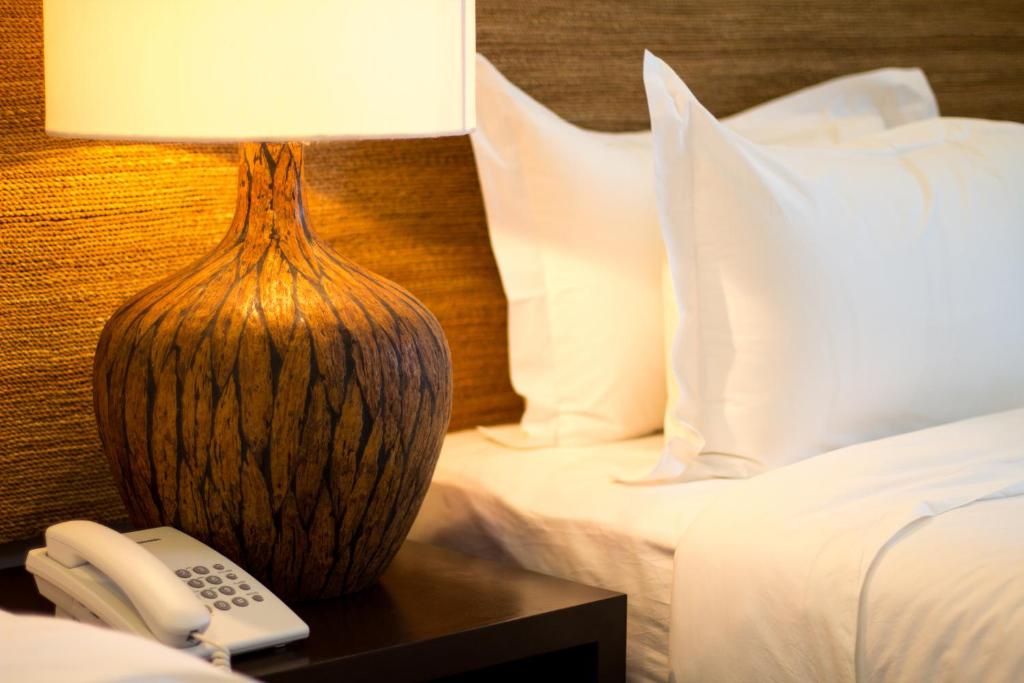 Postel nebo postele na pokoji v ubytování Azia Suites and Residences