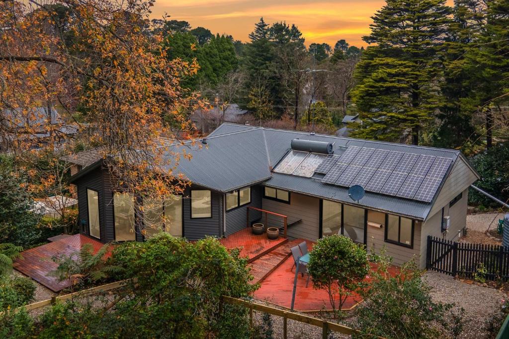 an aerial view of a house with solar panels on it at Leura Pines in Leura
