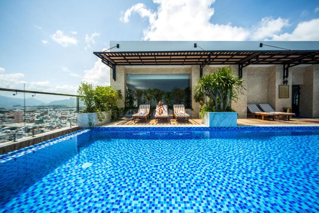 a swimming pool on the roof of a building at Putin Hotel Nha Trang in Nha Trang