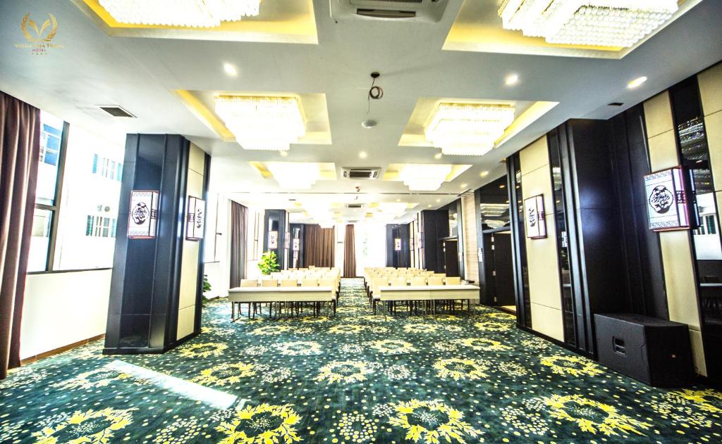a conference room with tables and chairs in a building at Putin Hotel Nha Trang in Nha Trang