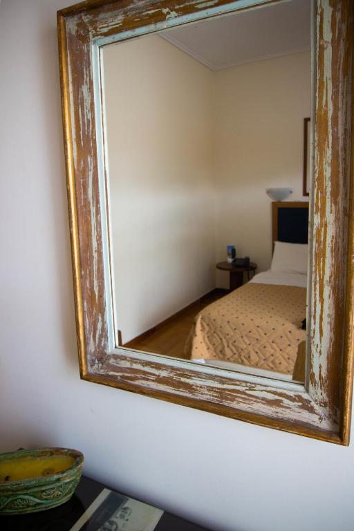 Postel nebo postele na pokoji v ubytování Adams Hotel