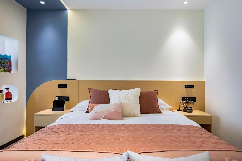 Postel nebo postele na pokoji v ubytování Cheng Jin Hotel