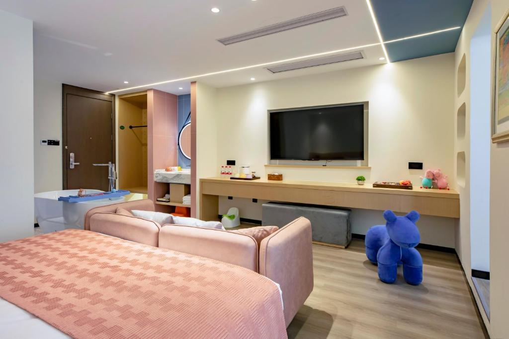 TV a/nebo společenská místnost v ubytování Cheng Jin Hotel