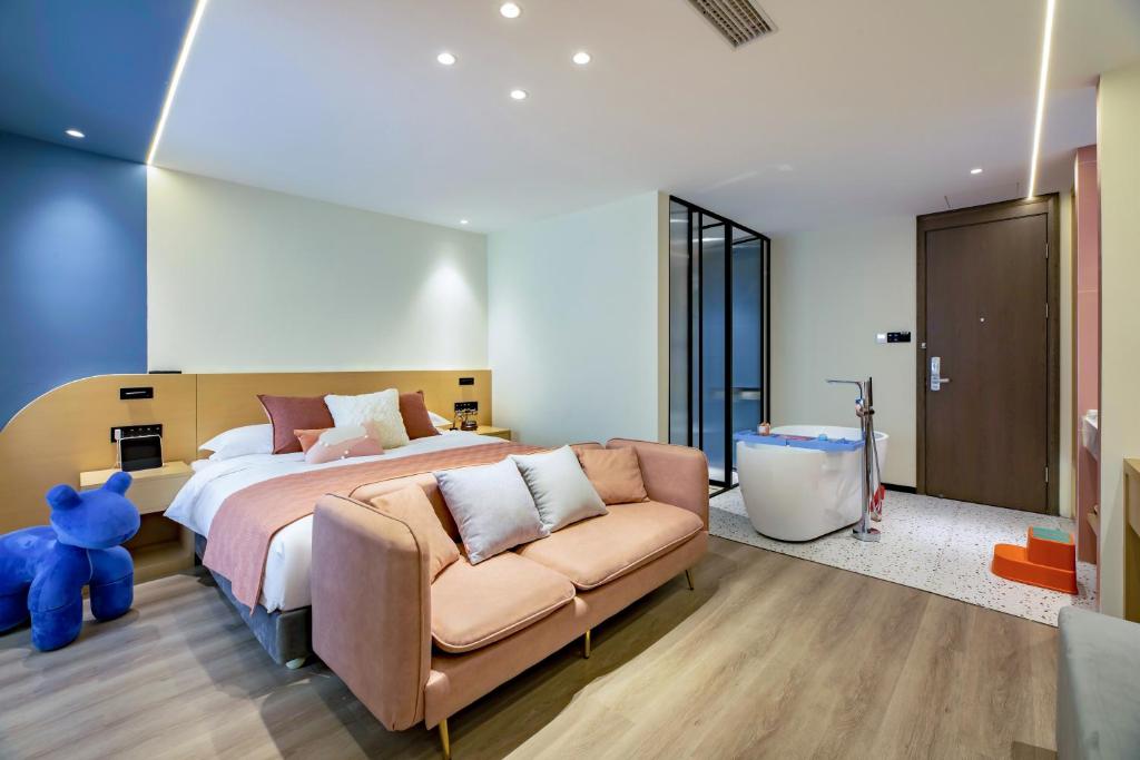 Postel nebo postele na pokoji v ubytování Cheng Jin Hotel