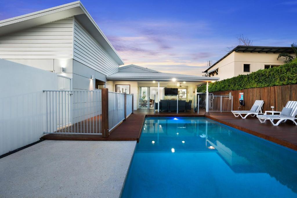 a swimming pool in the backyard of a house at 22 Sorrento Avenue in Coolum Beach