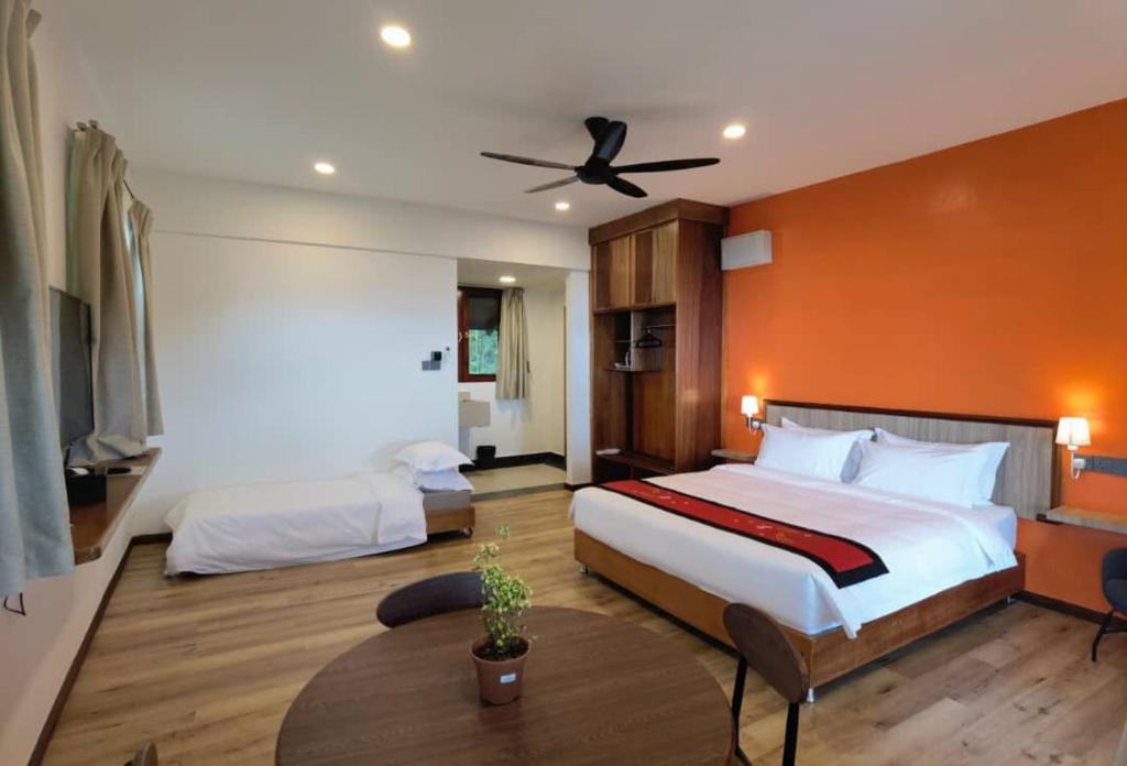 Säng eller sängar i ett rum på Kokol Haven Resort