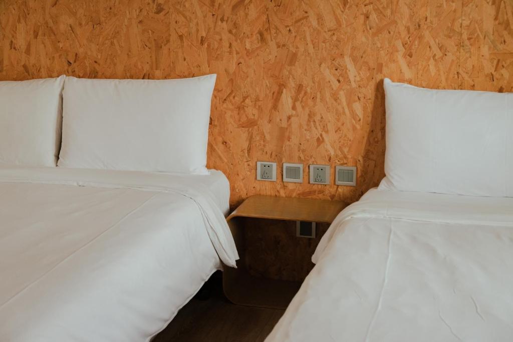 Postel nebo postele na pokoji v ubytování Light Hostel - Tainan