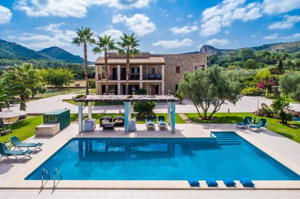 an image of a villa with a swimming pool at Ideal Property Mallorca - Ca na Siona 6 PAX in Alcudia