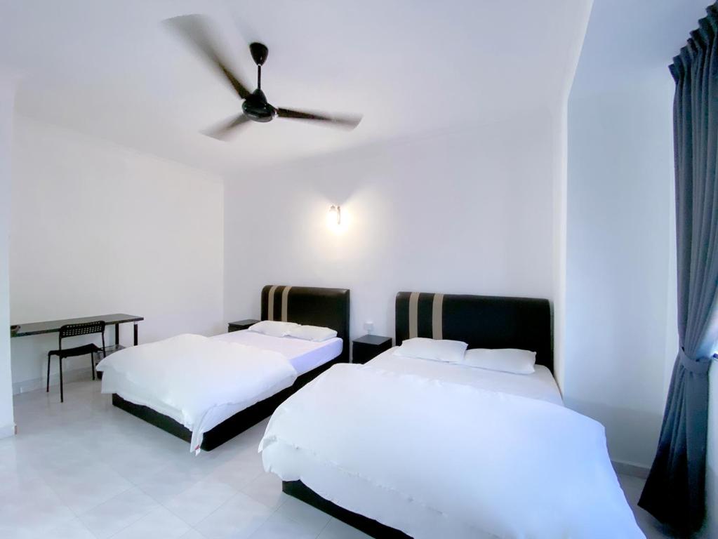 Voodi või voodid majutusasutuse Venice Guest Hostel - Bilik Sahaja toas