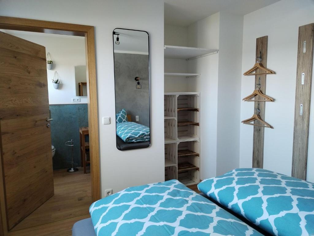 Postel nebo postele na pokoji v ubytování Ferienwohnung am Gänsbach