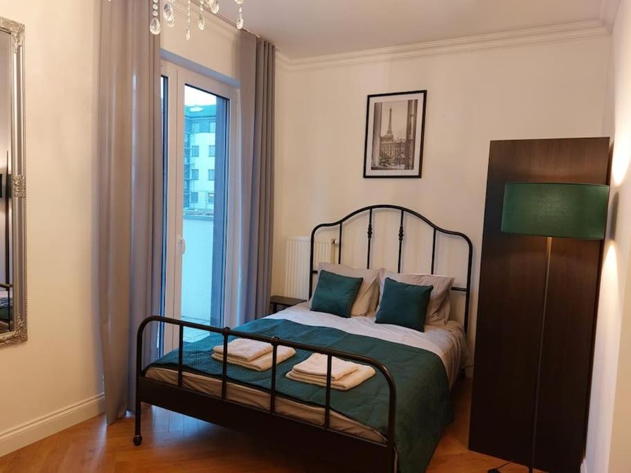 Apartament Poziomkowa tesisinde bir odada yatak veya yataklar