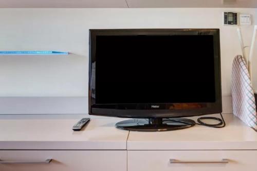 TV a/nebo společenská místnost v ubytování Beijing Yasmine Seasons Park Apartment Hotel