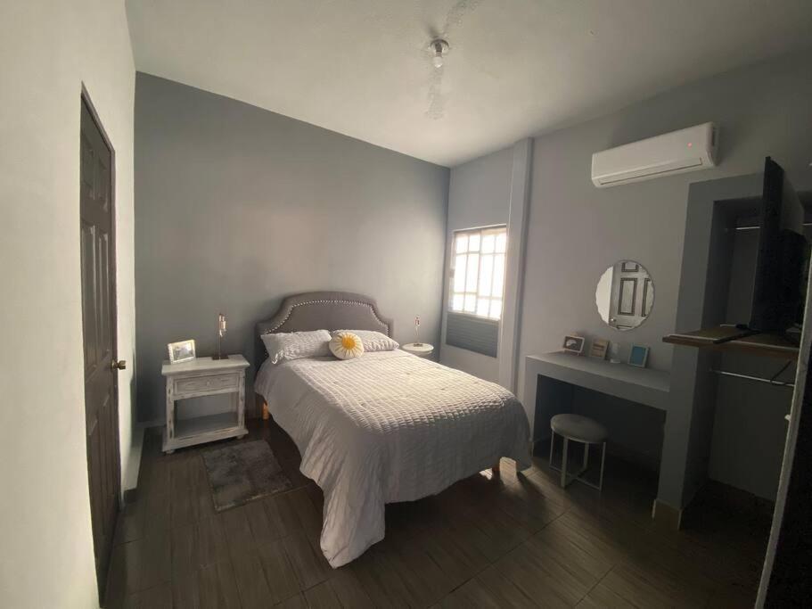 Кровать или кровати в номере Casa “La Santa”