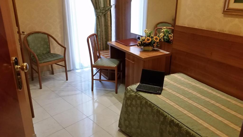 Postel nebo postele na pokoji v ubytování Hotel Teti