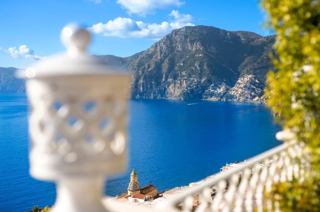 a balcony with a view of a body of water at La Barbera in Praiano