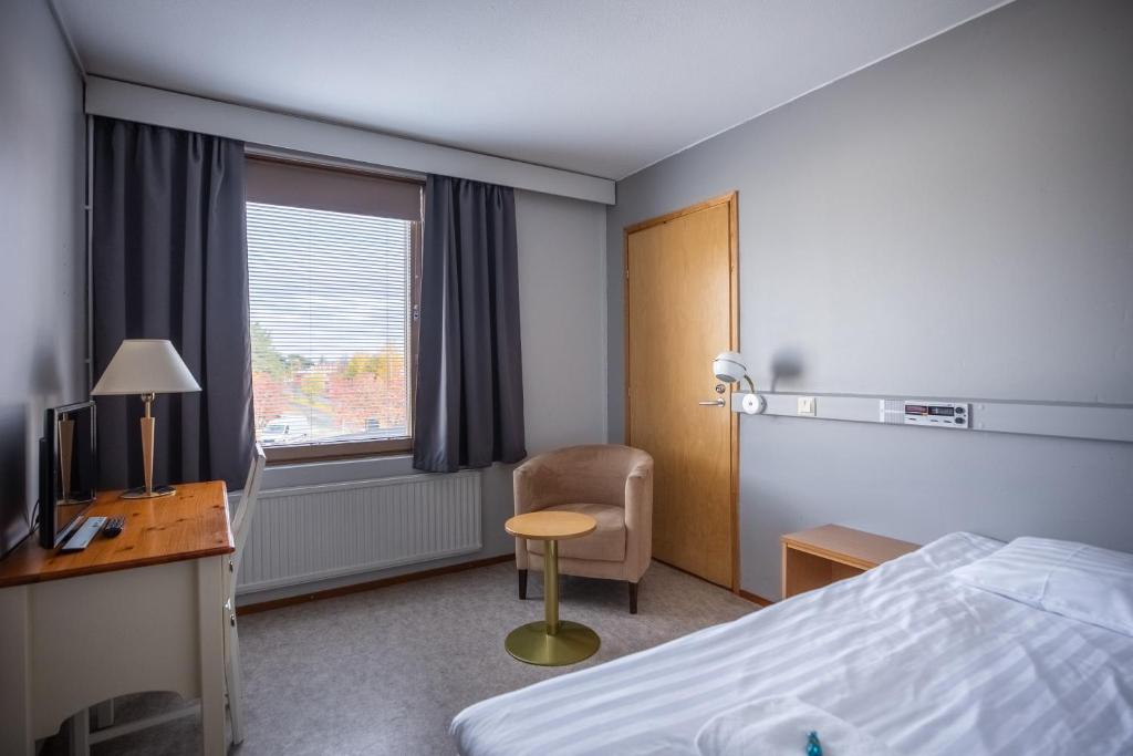 Postel nebo postele na pokoji v ubytování Hotel Karhu