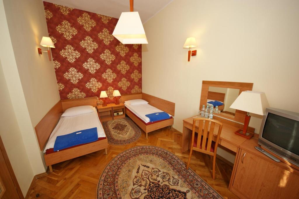 TV a/nebo společenská místnost v ubytování Hotel Zamkowy