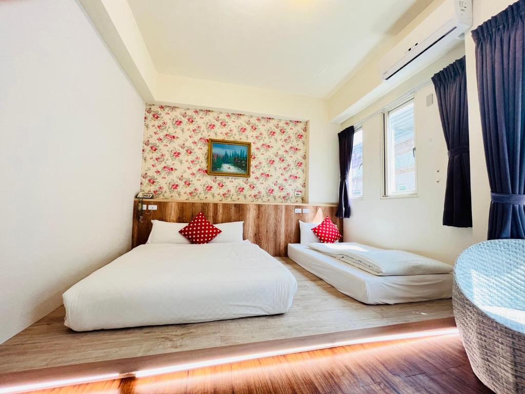 Postel nebo postele na pokoji v ubytování Sweet B&B 幸福微甜民宿
