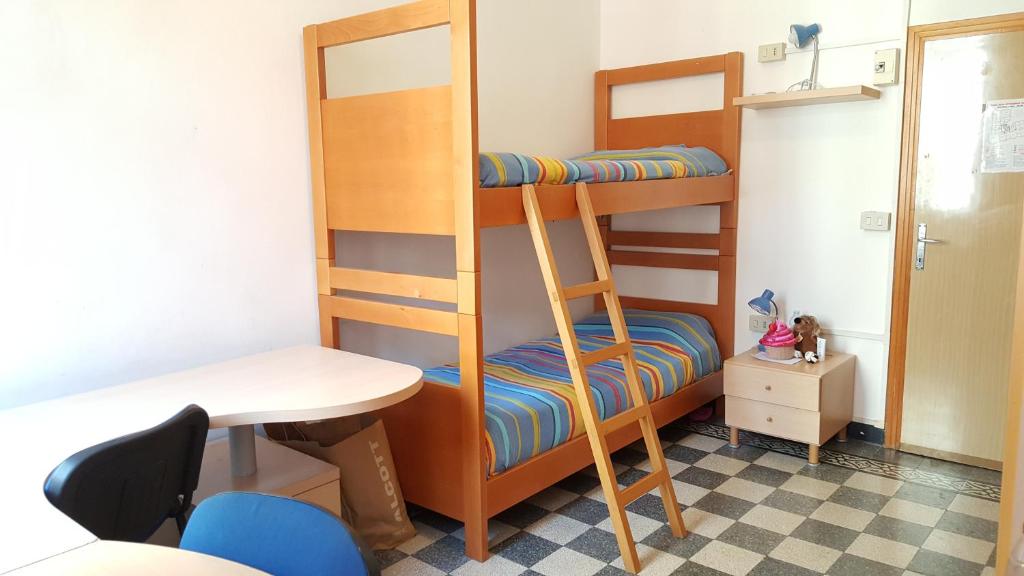 Postel nebo postele na pokoji v ubytování Ostello Domus Civica