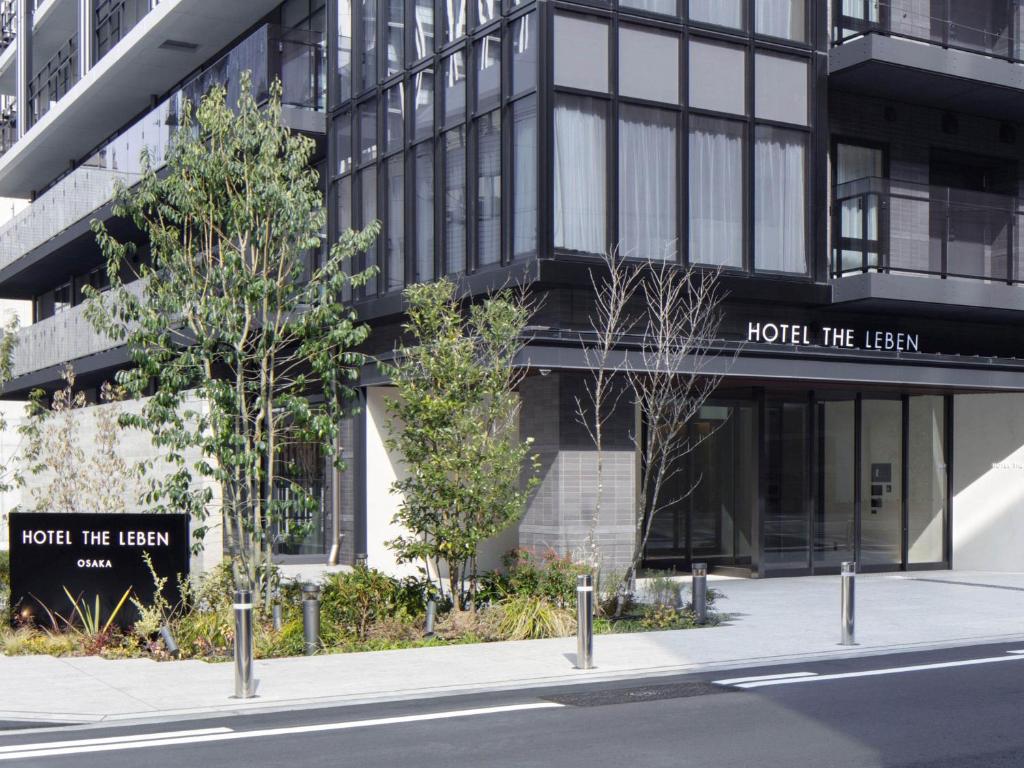 a building with a sign that reads hotel the lean at HOTEL THE LEBEN OSAKA in Osaka