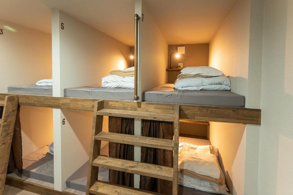 Postel nebo postele na pokoji v ubytování Hütte Jil Shirakabako