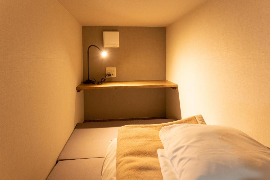 Postel nebo postele na pokoji v ubytování Hütte Jil Shirakabako