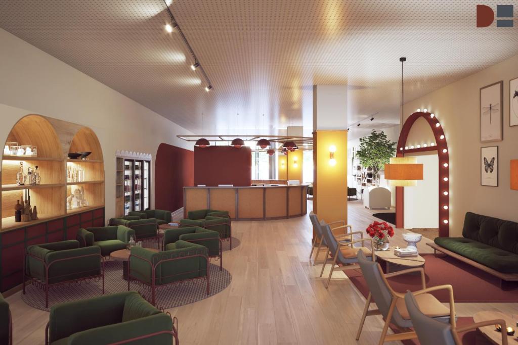 ジュネーヴにあるB&B HOTEL Geneva Airportの緑の椅子とテーブルが備わる待合室