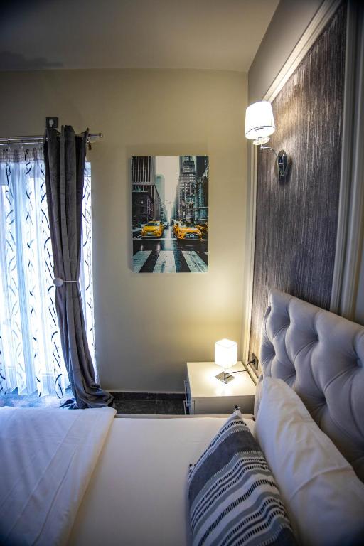 Postel nebo postele na pokoji v ubytování Hotel Pamela Concept