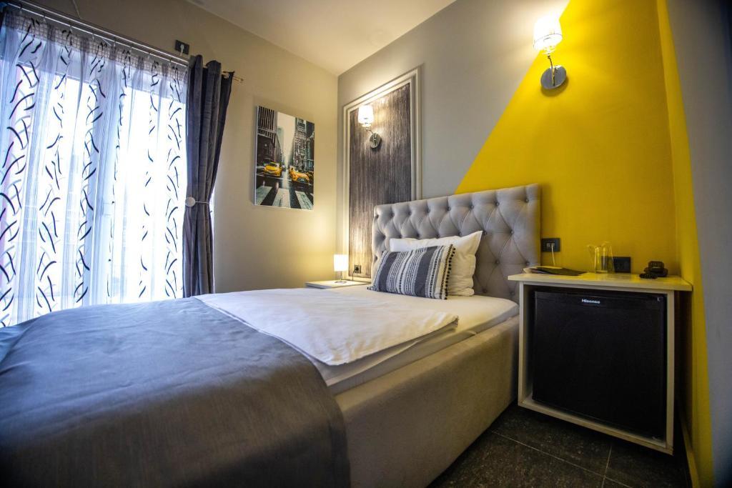 Postel nebo postele na pokoji v ubytování Hotel Pamela Concept