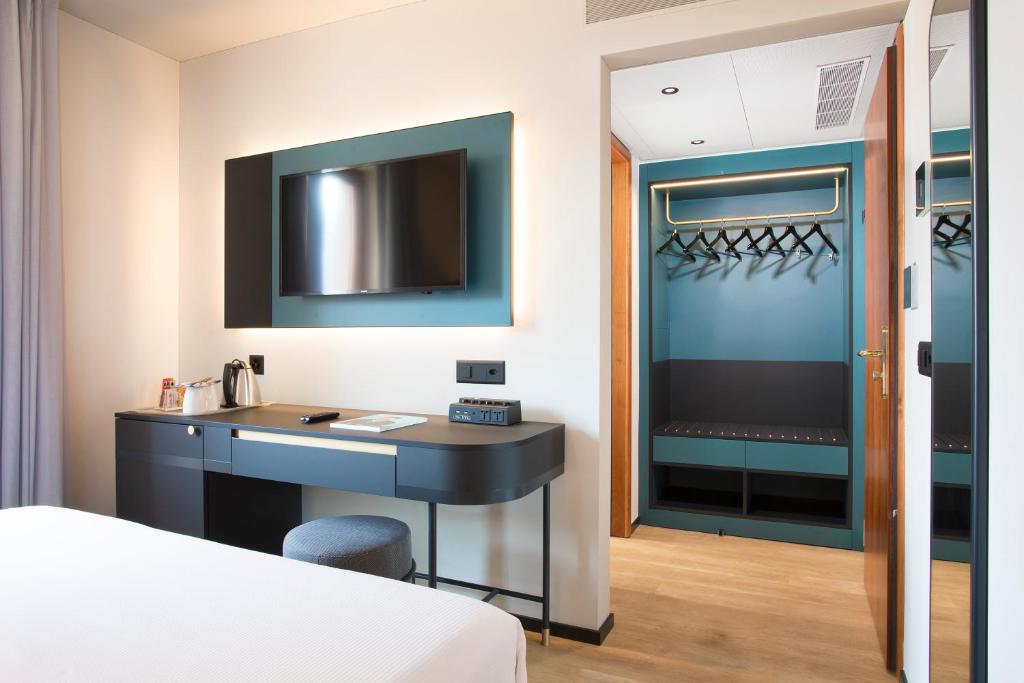 Postel nebo postele na pokoji v ubytování LUGANODANTE Boutique & Lifestyle Hotel
