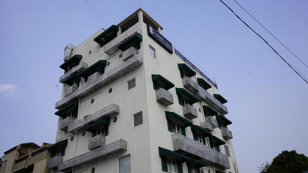 a building with balconies on the side of it at POD N BEYOND SMART HOTEL @BISTUPUR in Jamshedpur