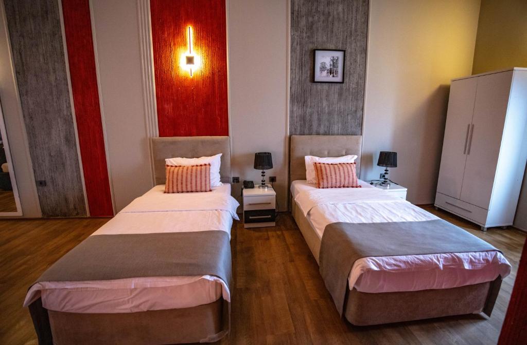 Postel nebo postele na pokoji v ubytování Hotel Pamela Concept