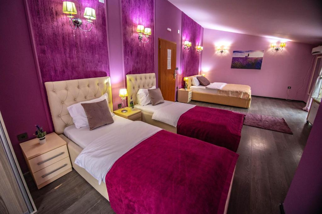 Postel nebo postele na pokoji v ubytování Hotel Pamela Concept