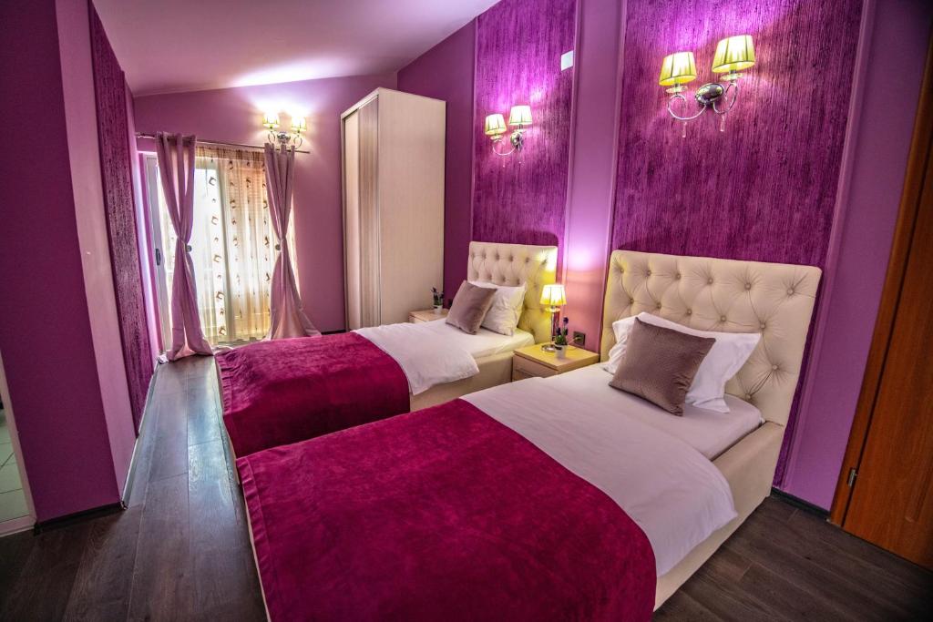 Postel nebo postele na pokoji v ubytování Hotel Pamela Concept