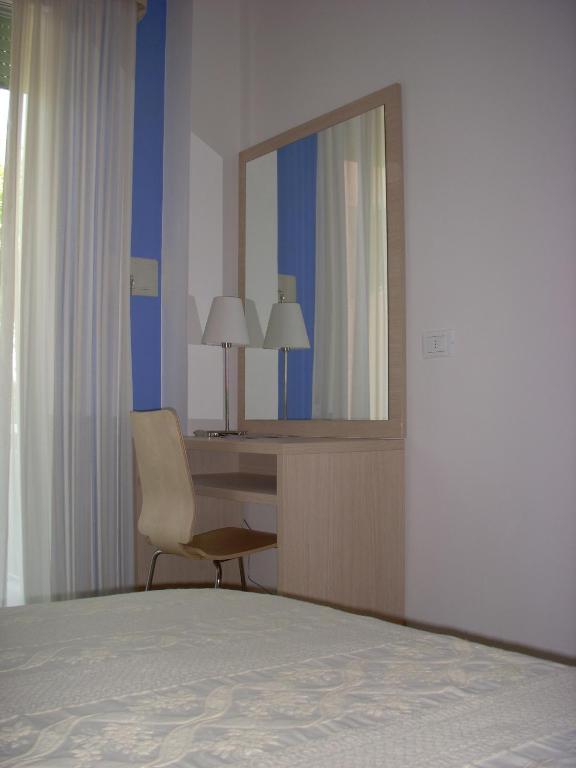 Postel nebo postele na pokoji v ubytování Hotel Mary Fleur
