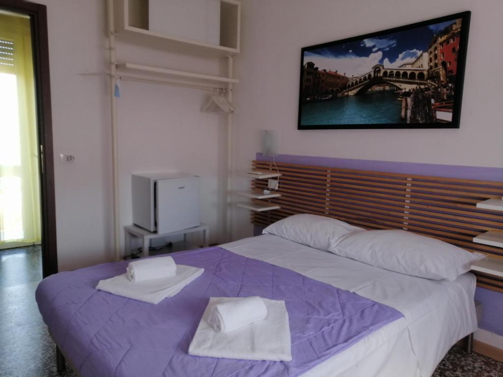 Postel nebo postele na pokoji v ubytování GreenColors Hotel