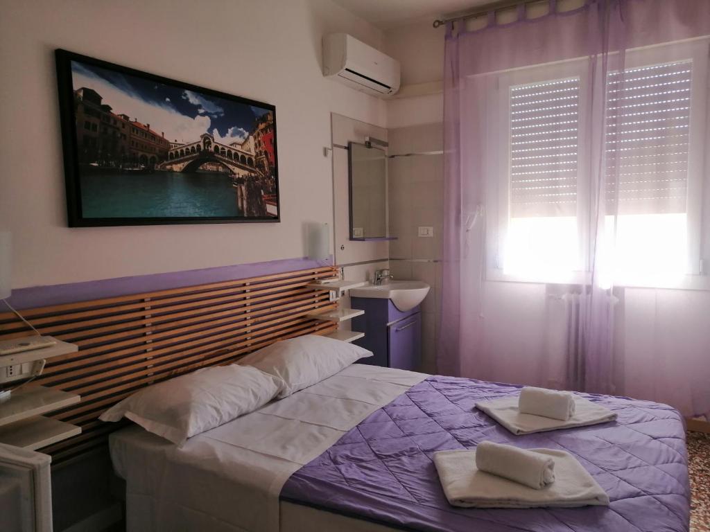 Postel nebo postele na pokoji v ubytování GreenColors Hotel