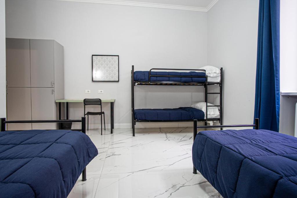 Postel nebo postele na pokoji v ubytování Palladini Rome