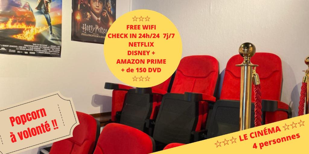 a bunch of red chairs with signs on them at Le cinéma in Soultz-sous-Forêts