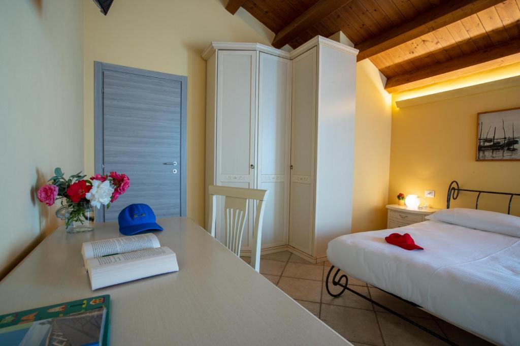 Postel nebo postele na pokoji v ubytování Hotel Caneo
