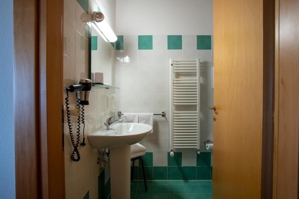 Koupelna v ubytování Hotel Caneo