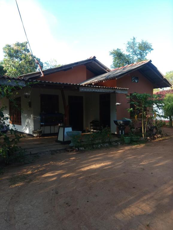a house with a dirt road in front of it at Southbank Homestay 