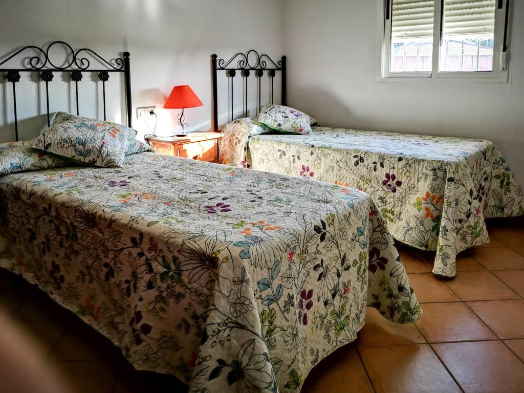 Łóżko lub łóżka w pokoju w obiekcie Casa Rural Cerca de la Playa El Rompido