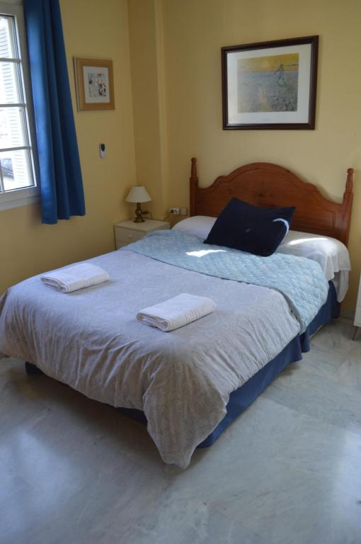 A bed or beds in a room at Apartamento Adoratrices