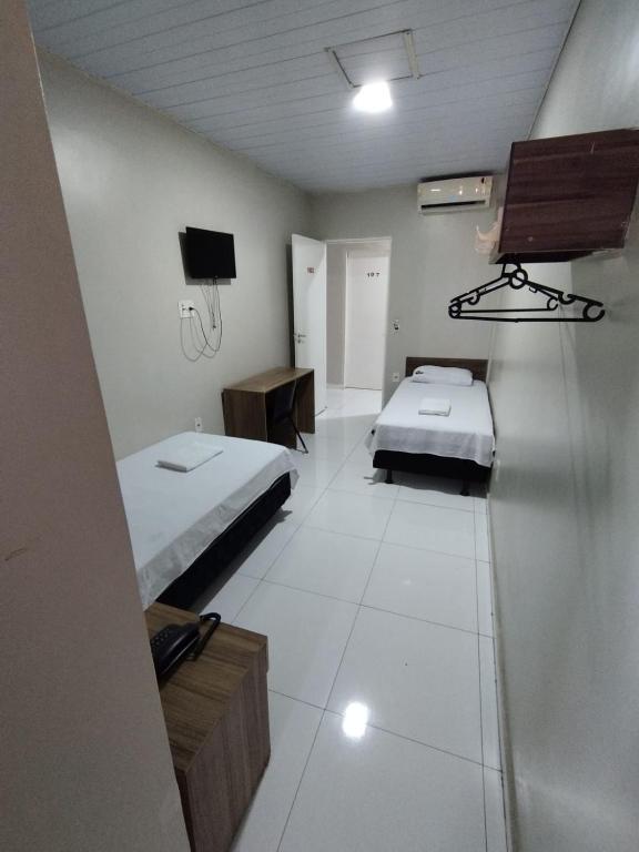 Postel nebo postele na pokoji v ubytování Hotel Resende